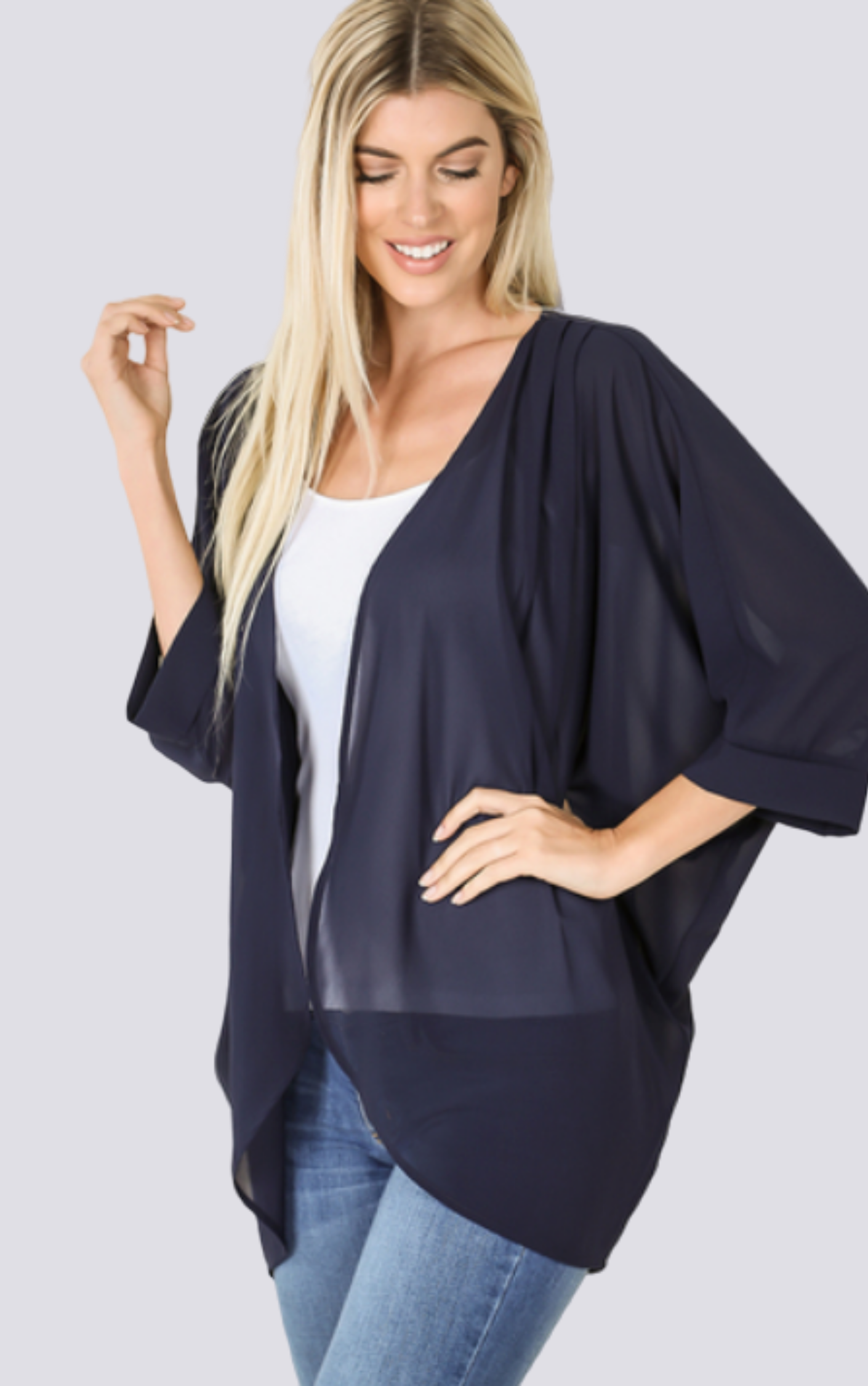 The Chiffon Kimono Plus in Navy blue color is expertly crafted with luxurious polyester fabric. Perfect for any occasion, this kimono offers effortless style and comfort. Its lightweight and flowy design drapes elegantly, while the versatile, plus size fit ensures a flattering silhouette. Embrace the elegance and grace of this timeless piece.