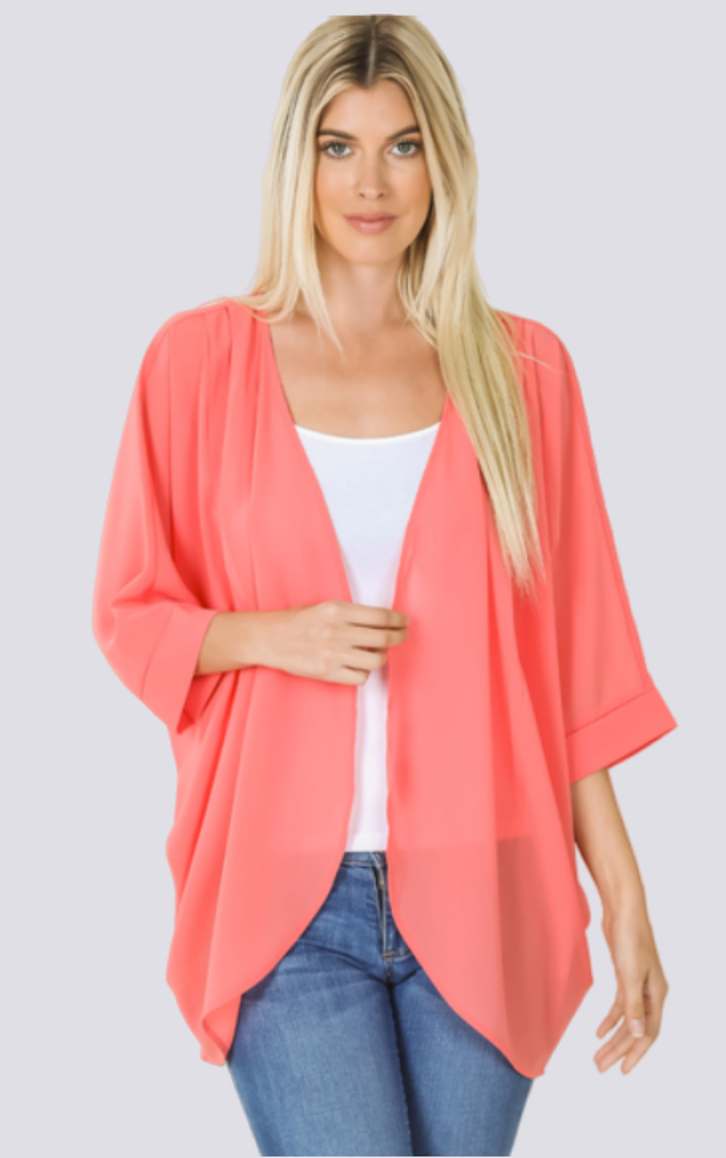 The Chiffon Kimono Plus in deep coral orange is expertly crafted with luxurious polyester fabric. Perfect for any occasion, this kimono offers effortless style and comfort. Its lightweight and flowy design drapes elegantly, while the versatile, plus size fit ensures a flattering silhouette. Embrace the elegance and grace of this timeless piece.