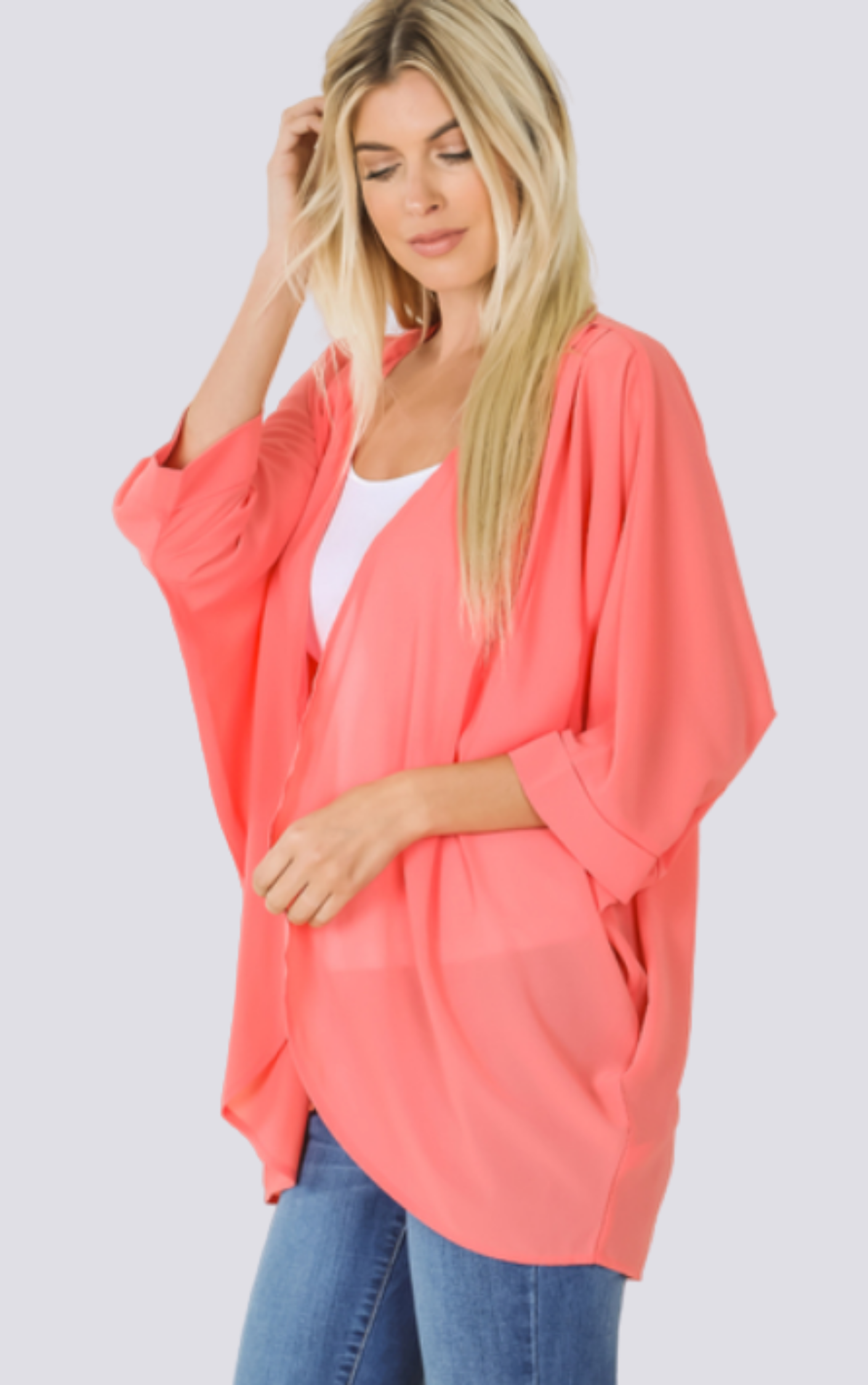 The Chiffon Kimono Plus in deep coral orange is expertly crafted with luxurious polyester fabric. Perfect for any occasion, this kimono offers effortless style and comfort. Its lightweight and flowy design drapes elegantly, while the versatile, plus size fit ensures a flattering silhouette. Embrace the elegance and grace of this timeless piece.